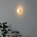 Gold metal and white glass wall light