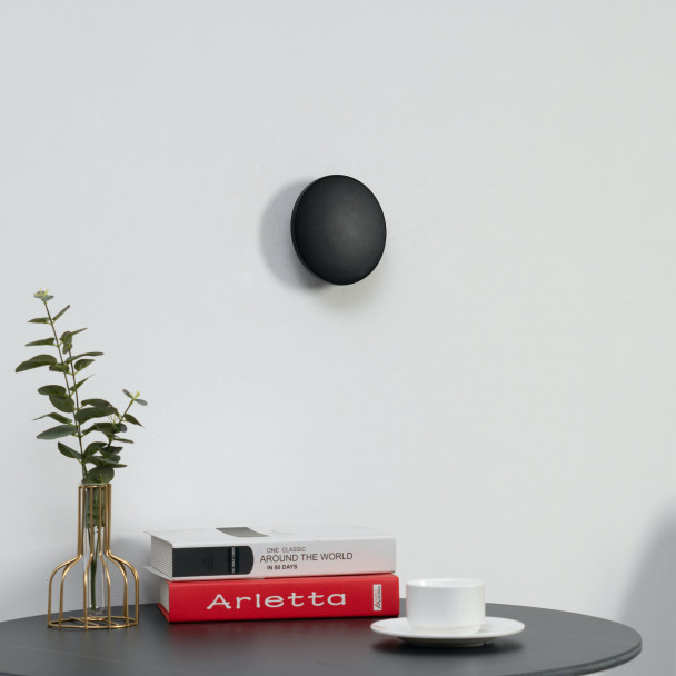 Discreet and economical wall light