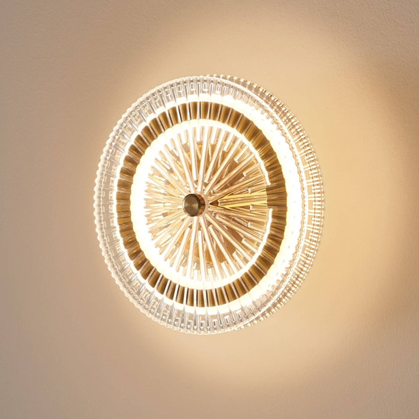 Gold LED wall light with clear glass disc - Alma
