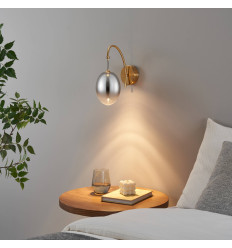 Gold arched LED wall light with oval globe - Nuvéo